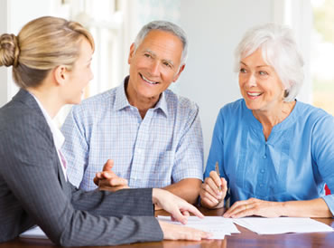 Elderly couple meeting with funeral planner